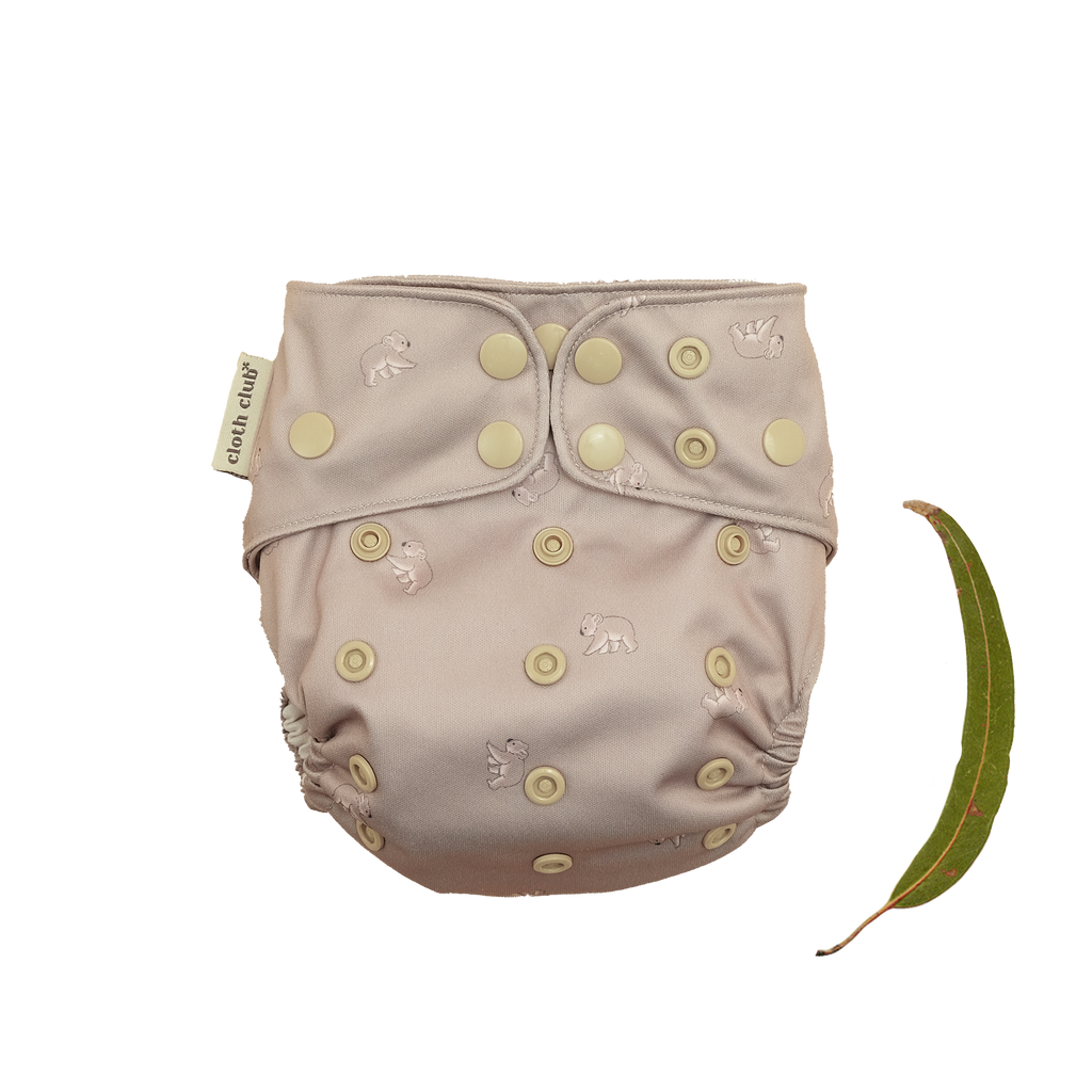 'Koala Cuddles' is a gender neutral, Australiana inspired print. It features adorable little, hand-illustrated koalas on a lovely neutral taupe background. Cloth Club Reusable Nappies